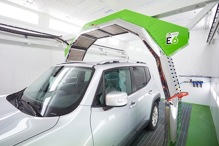 Greentech robot curing paint on an electric car